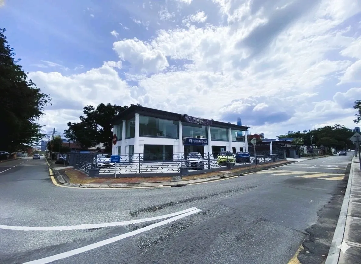 Dongfeng dealership showroom building on a street corner under a blue sky