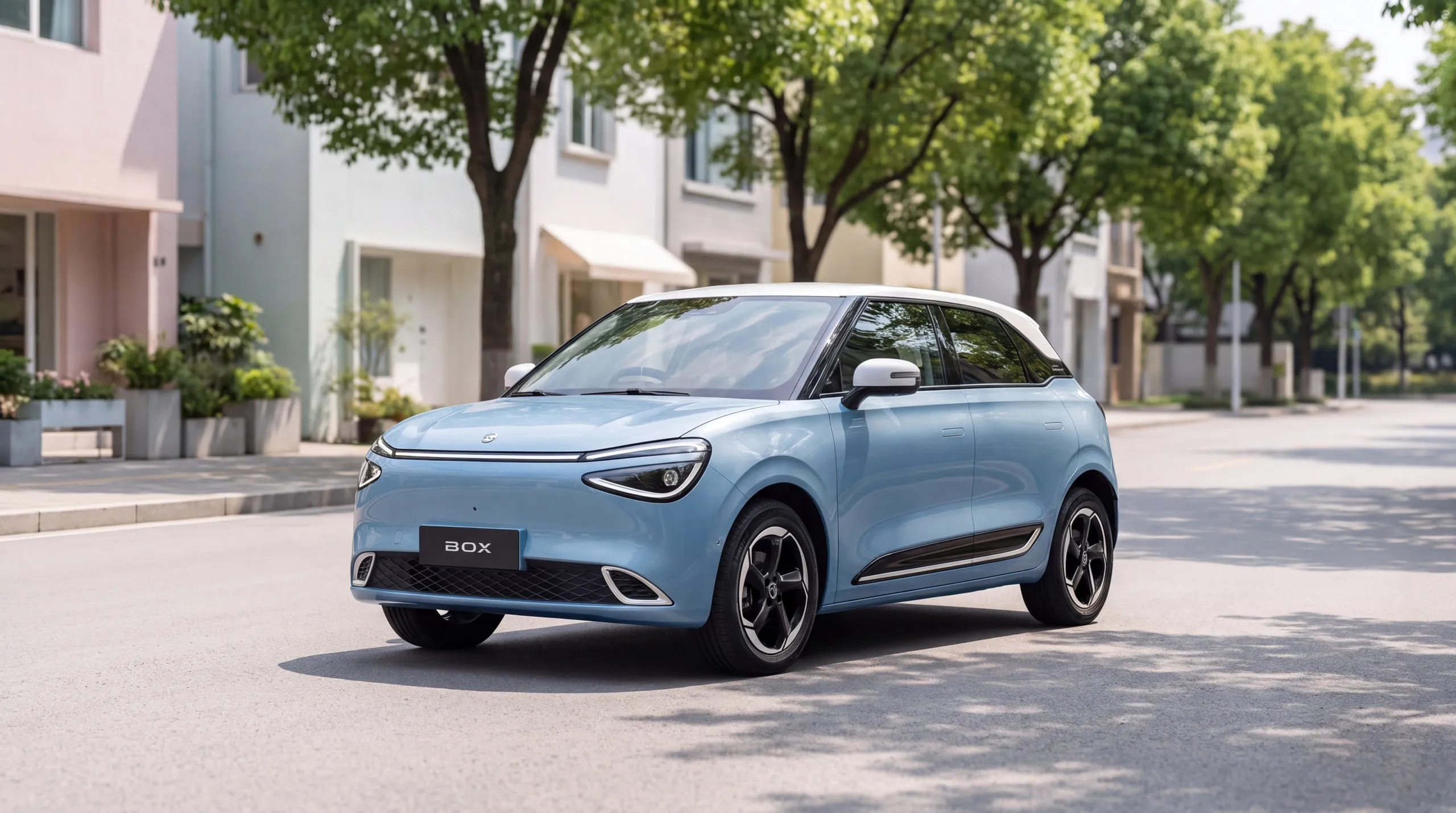 Dongfeng BOX: light blue electric hatchback with a white roof, parked on a leafy suburban street
