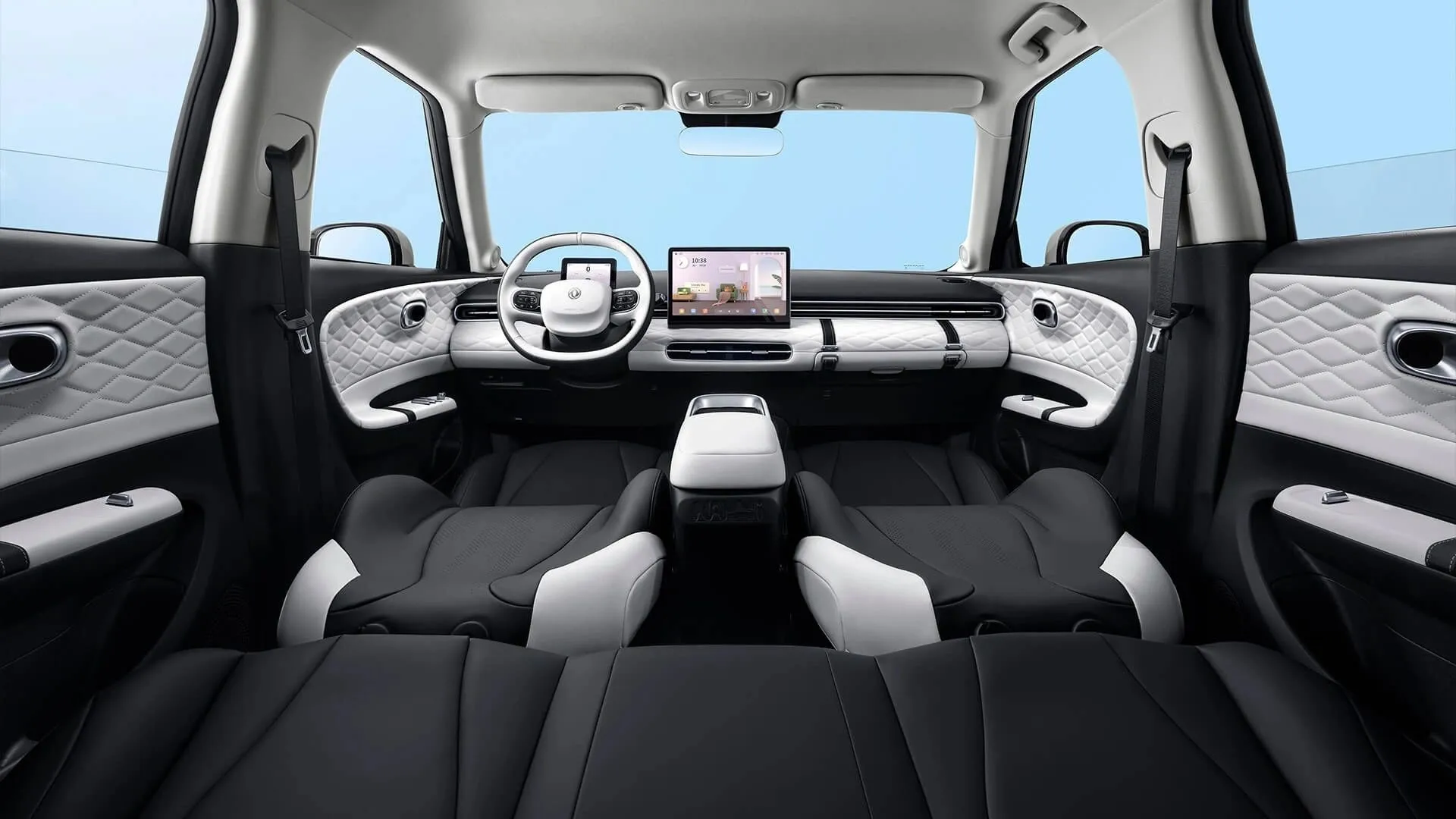 Wide view of the Dongfeng BOX interior with seats folded flat and quilted white dashboard