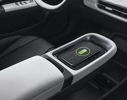 Open charging port flap on the front fender of a white Dongfeng BOX