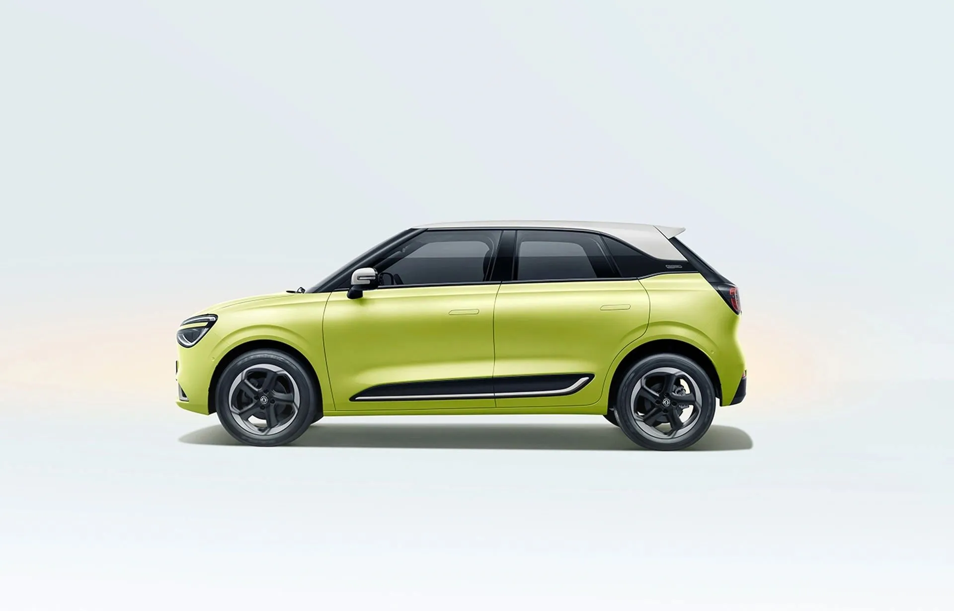 Side profile of a lime green Dongfeng BOX with white roof in a bright studio