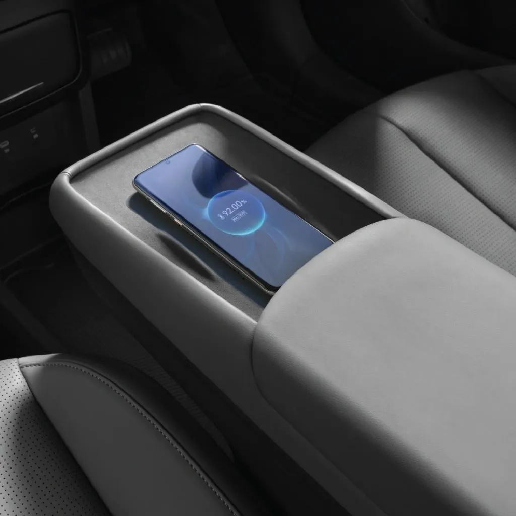 Phone on the Dongfeng VIGO wireless charging pad in the centre console